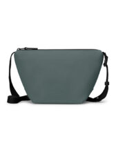 Ucon Acrobatics Nola Bag Lotus Pine Green is a sleek crossbody bag with a soft matte finish