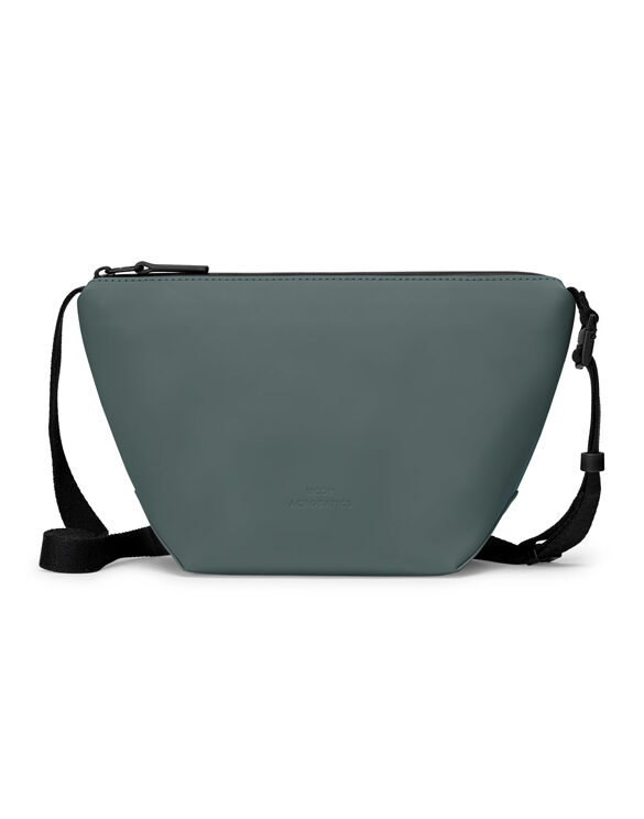 Ucon Acrobatics Nola Bag Lotus Pine Green is a sleek crossbody bag with a soft matte finish
